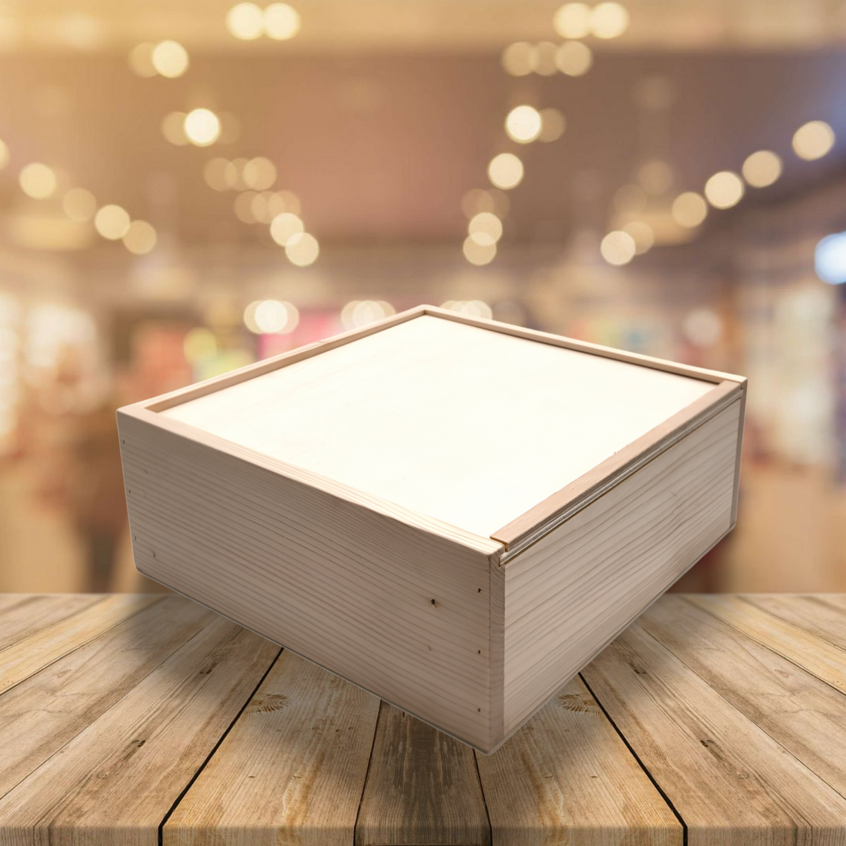 Holzkiste mit weißer Innenseite, hellgrauer Außenseite und einfachem Design.