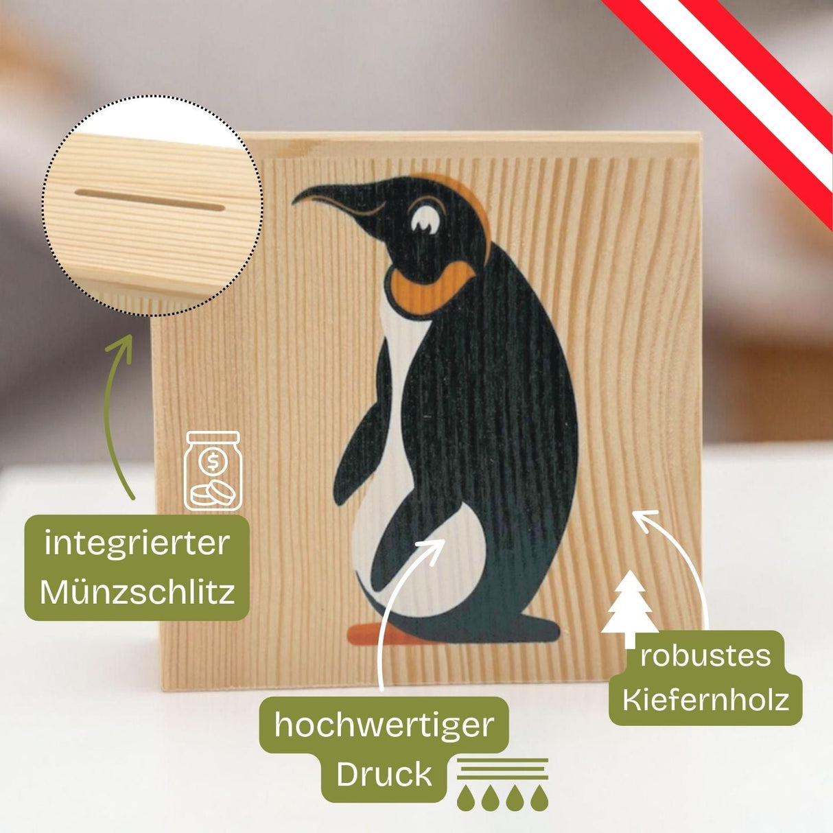 Sparschwein aus Holz mit Pinguinmotiv.