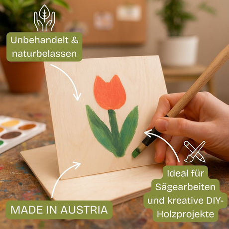 Einfaches Holzbrett mit einem gemalten Tulpenmotiv, das von einer Person gehalten wird.