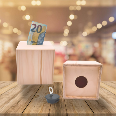 20-Euro-Schein in einer weißen, modernen, blockförmigen Schachtel mit kreisförmigem Ausschnitt.