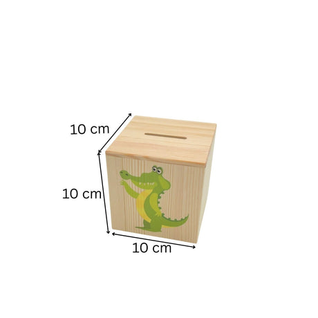 Würfelförmige Spardose aus Holz mit einem Cartoon-Alligator-Motiv.