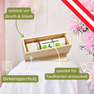 Holzkiste mit einer dekorierten Kerze.