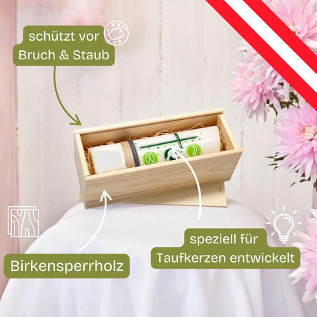 Holzkiste mit einer dekorierten Kerze.